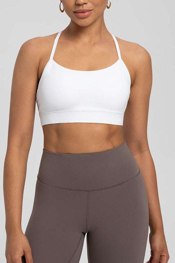 Comfort Zone Thin Strap Sports Bra Top in white with 4-way stretch Lycra, offering medium support and sleek fit for activewear routines.