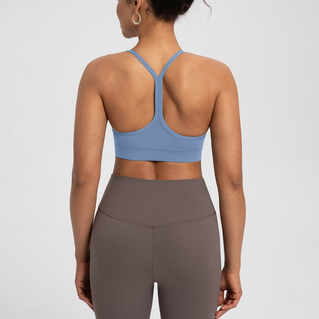 Back view of Comfort Zone Thin Strap Sports Bra Top in blue, featuring 4-way stretch Lycra and medium support for activewear performance.