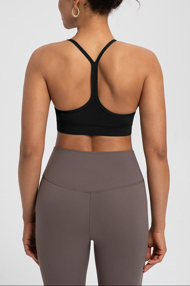 Back view of Comfort Zone Thin Strap Sports Bra Top in black, featuring racerback design and 4-way stretch Lycra for medium support and mobility.
