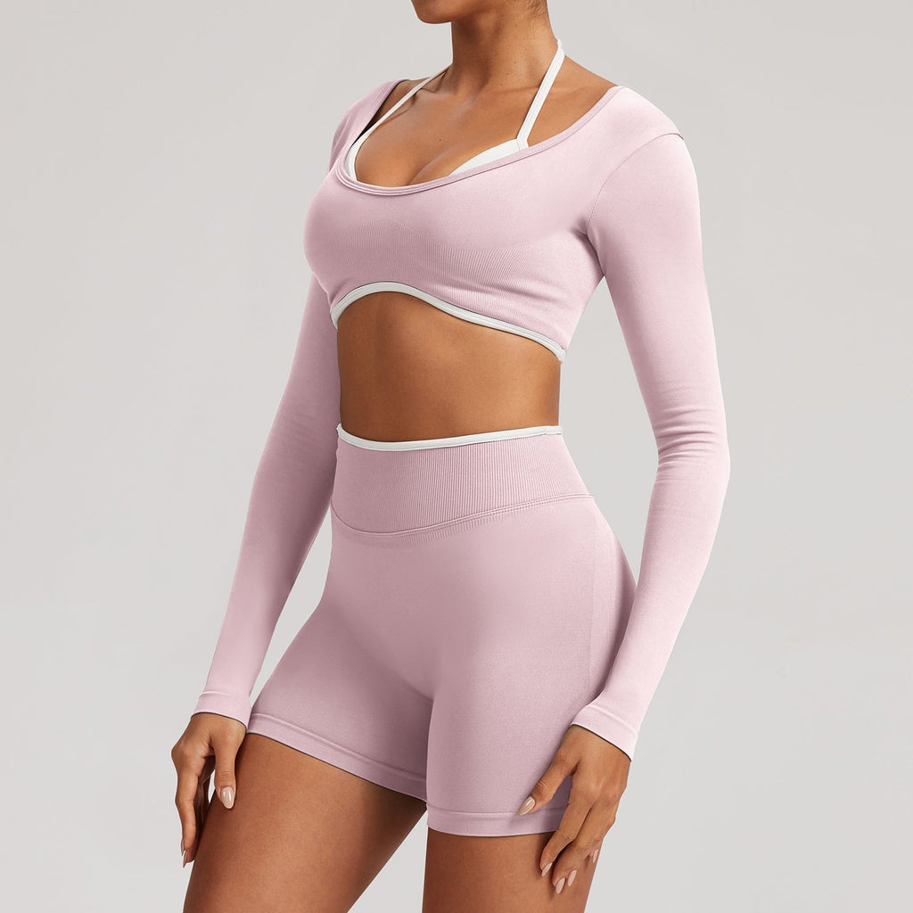 The Elevate Seamless Long Sleeve & Thin Strap Sports Bra Top in soft pink, designed with a flattering scoop neckline and seamless finish.