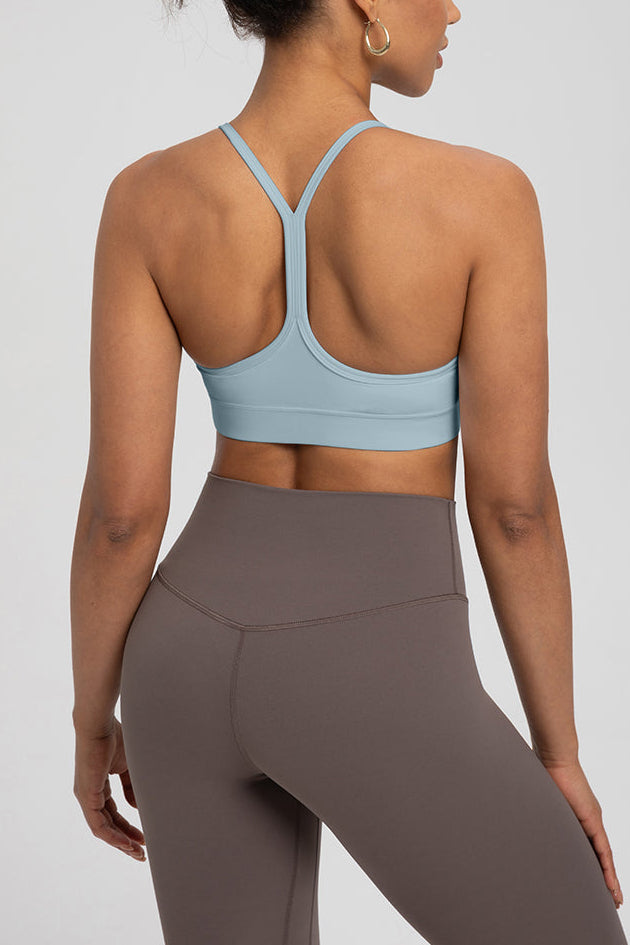 Back view of Comfort Zone Thin Strap Sports Bra Top in light blue with 4-way stretch Lycra and medium support, ideal for activewear use.