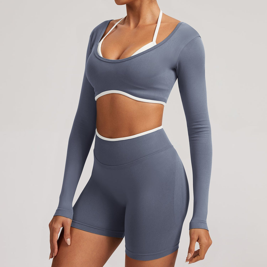The Elevate Seamless Long Sleeve & Thin Strap Sports Bra Top in steel blue, offering a chic and functional look for activewear collections.