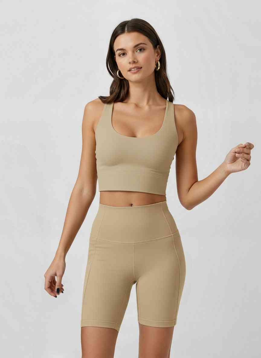 Supportive Racerback Sports Bra Top in beige with U-neck design and sculpted back. Ideal for activewear with built-in support and confident style.